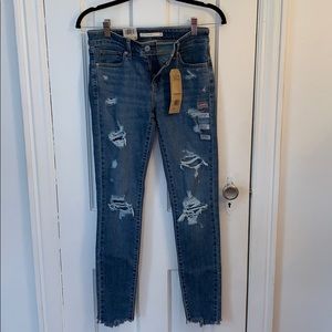 Levi’s 711 Mid Rise Distressed Skinny Jeans